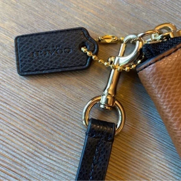 Coach colorblock wristlet. 100% authentic. Measures 8 1/2” x 5 3/4”. - Picture 3 of 3